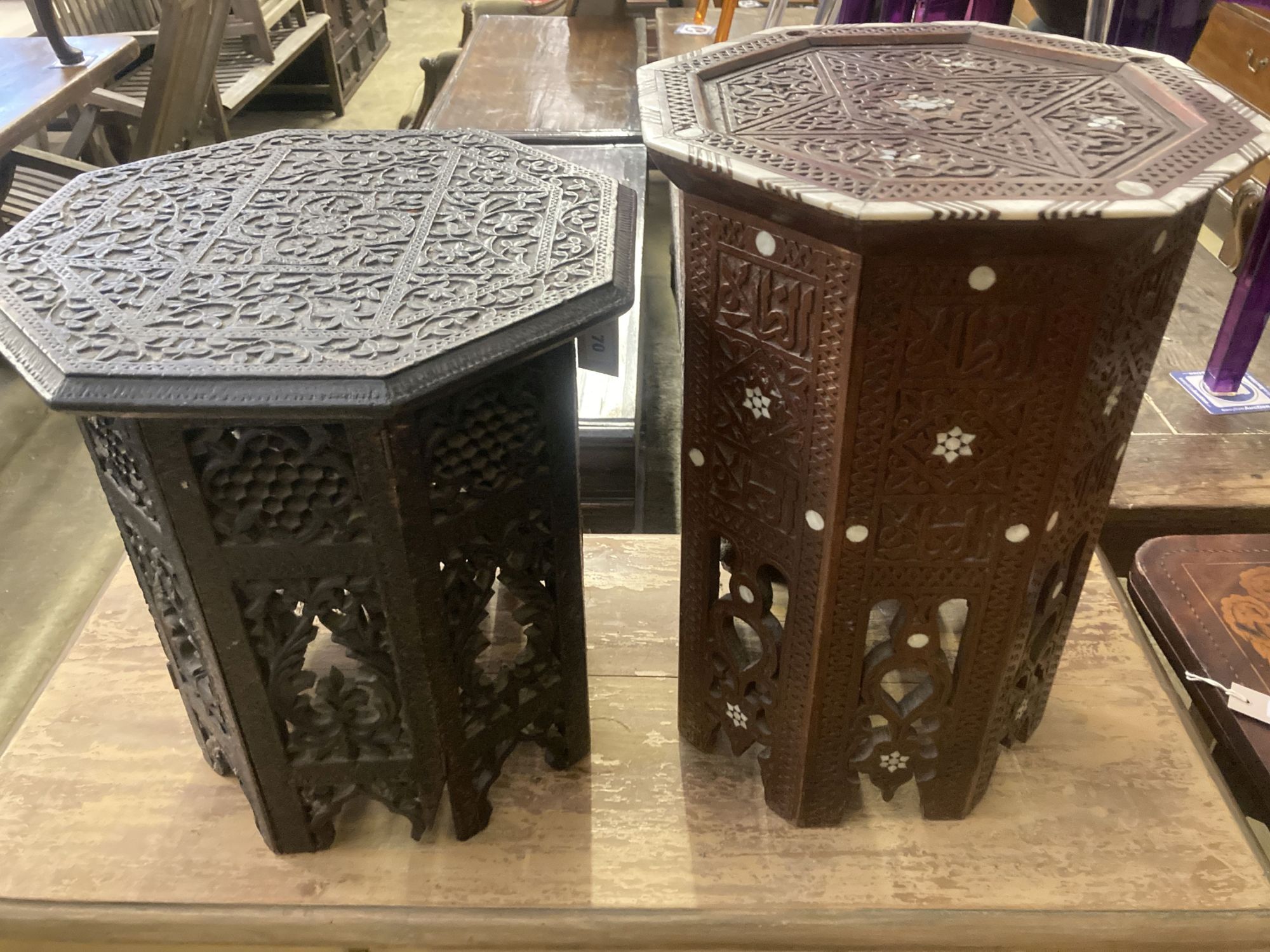 Two Moorish octagonal carved occasional tables, larger width 38cm, height 42cm